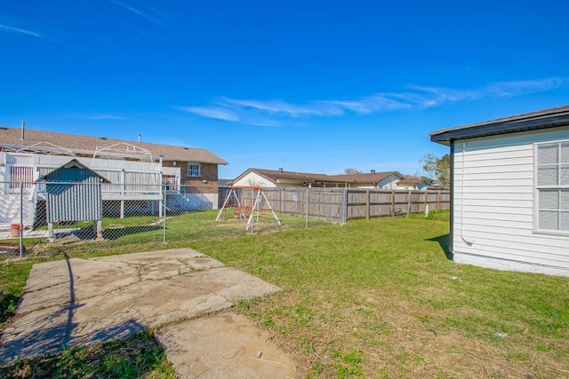 view of yard with a playground and a patio area