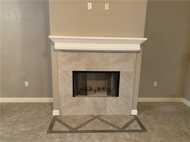 room details featuring a tile fireplace