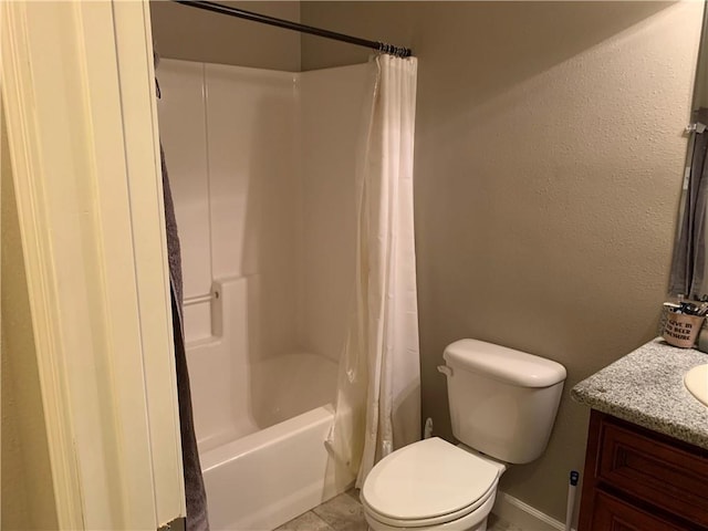 full bathroom with vanity, toilet, tile patterned flooring, and shower / bath combo with shower curtain