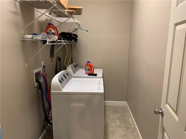 clothes washing area featuring washing machine and clothes dryer