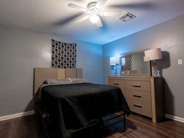 bedroom featuring ceiling fan and dark wood-type flooring