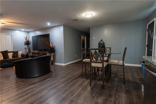 dining area with dark hardwood / wood-style floors and ceiling fan