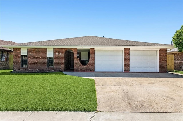 single story home with a garage and a front yard