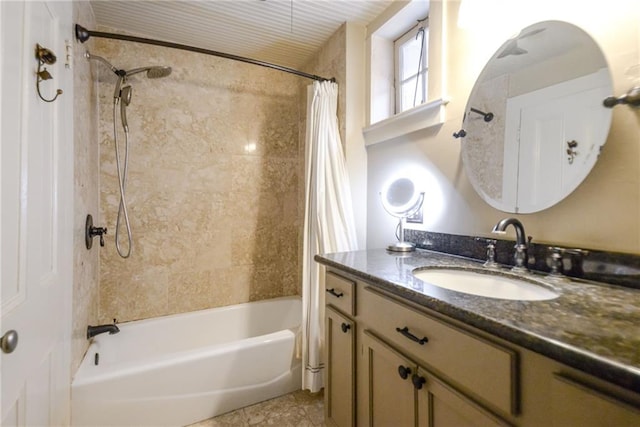 bathroom featuring tile patterned floors, vanity, and shower / bath combo with shower curtain