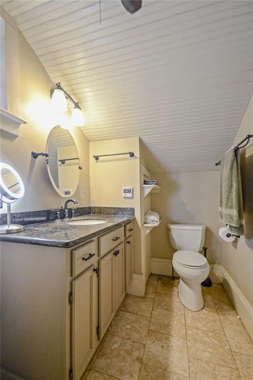 bathroom featuring toilet, vanity, vaulted ceiling, and wooden ceiling