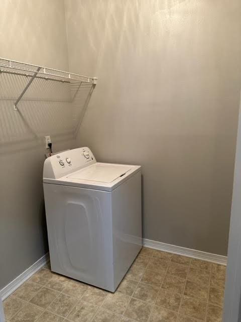 clothes washing area featuring washer / clothes dryer