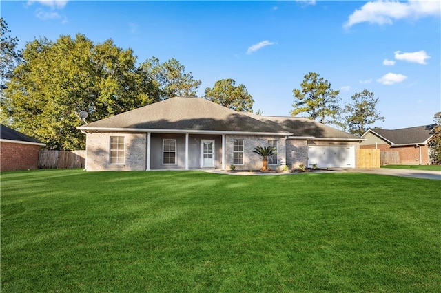 ranch-style house with a front yard and a garage