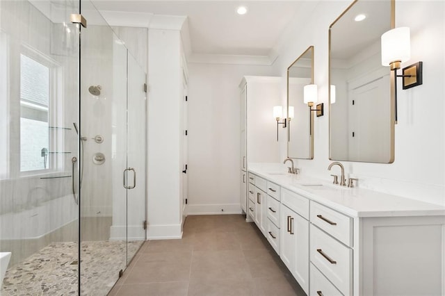 bathroom featuring vanity, crown molding, an enclosed shower, and tile patterned floors