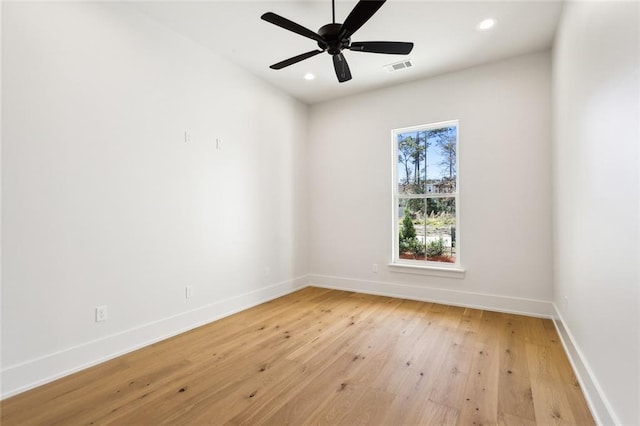 empty room featuring ceiling fan and light wood-type flooring