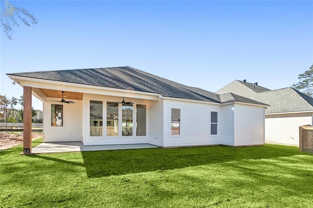 back of property featuring a patio area, ceiling fan, and a lawn