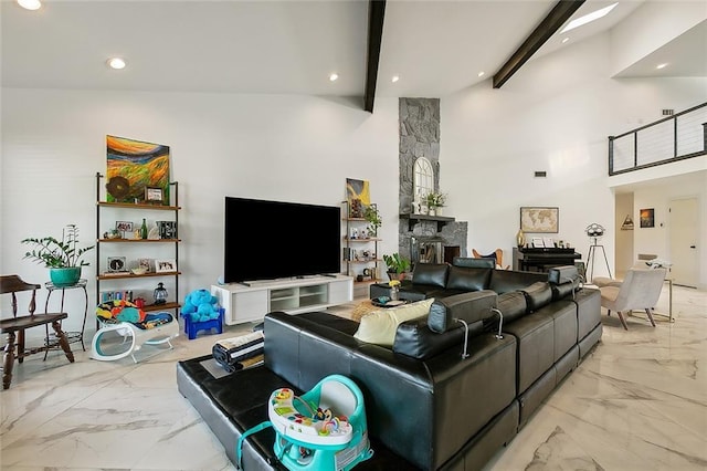 living room with beam ceiling, a fireplace, and high vaulted ceiling