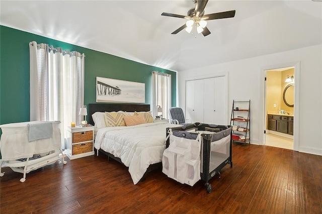 bedroom with ceiling fan, wood-type flooring, and multiple windows