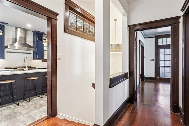 corridor with dark hardwood / wood-style floors