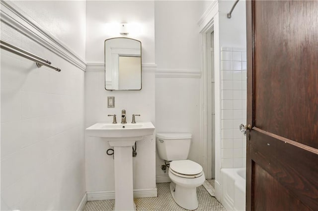 bathroom with tile patterned floors and toilet