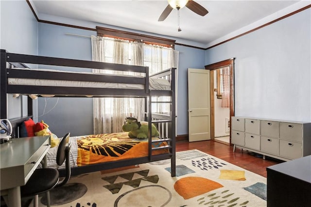 bedroom with ceiling fan, dark hardwood / wood-style floors, and ornamental molding