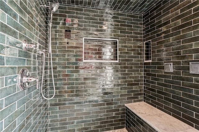 bathroom featuring tiled shower