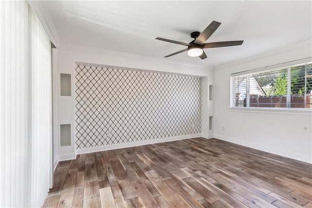 unfurnished room featuring hardwood / wood-style flooring, ceiling fan, and crown molding