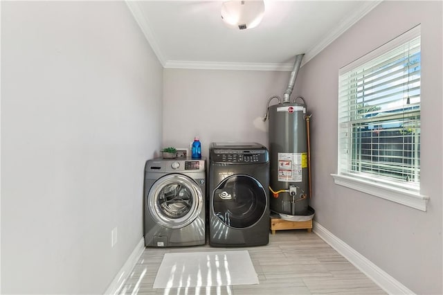 clothes washing area featuring separate washer and dryer, crown molding, and water heater