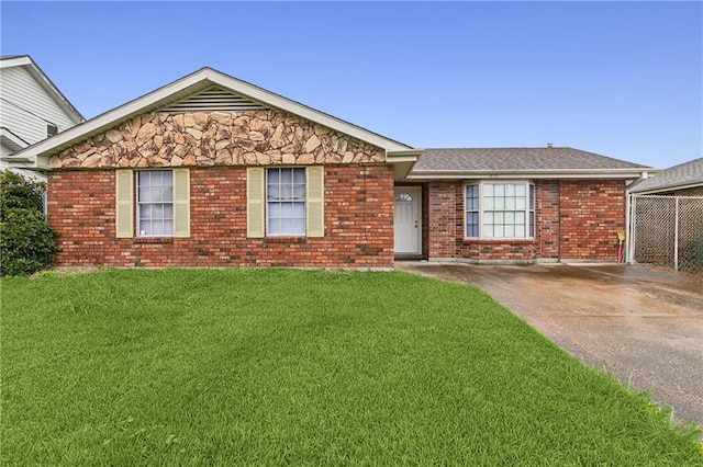 ranch-style home with a front lawn