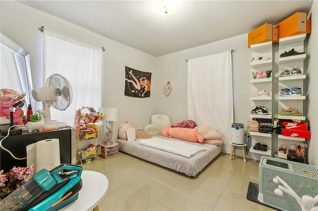 bedroom with light tile patterned floors