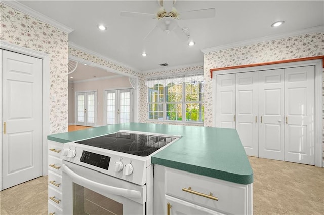 41298 Baytown Rd, Hammond, LA 70403 - kitchen with white electric stove, wallpapered walls, crown molding, ceiling fan, and french doors
