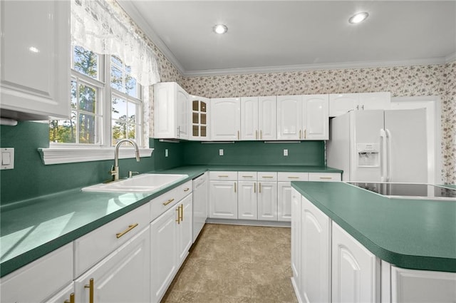 kitchen featuring sink, white cabinets, white appliances, and ornamental molding