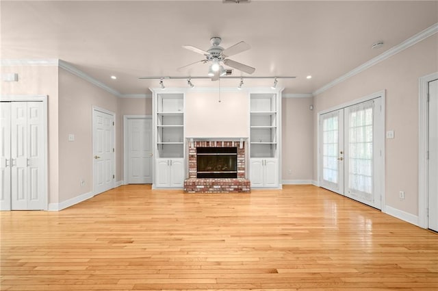 41298 Baytown Rd, Hammond, LA 70403 - unfurnished living room featuring light wood-style floors, ceiling fan, french doors, rail lighting, and ornamental molding