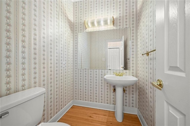 41298 Baytown Rd, Hammond, LA 70403 - bathroom with wood finished floors and wallpapered walls