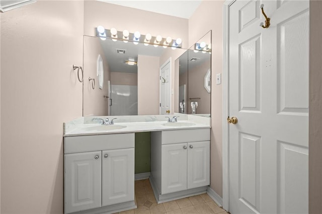 41298 Baytown Rd, Hammond, LA 70403 - bathroom with double vanity and tile patterned floors