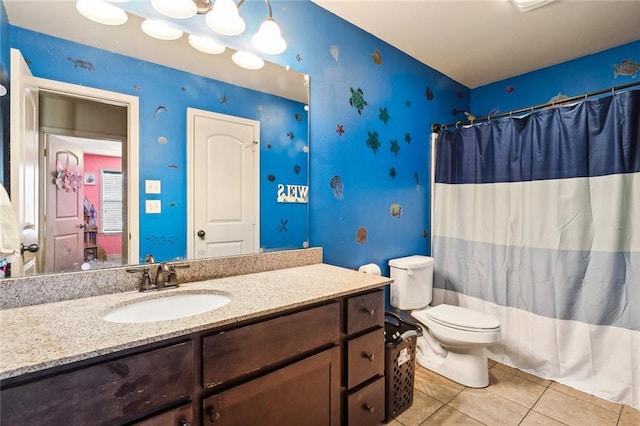 full bathroom with tile patterned flooring, shower / bath combination with curtain, vanity, and toilet