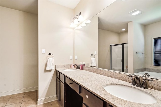 bathroom with plus walk in shower, tile patterned flooring, and vanity