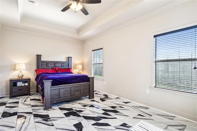 bedroom featuring a tray ceiling, multiple windows, and ceiling fan