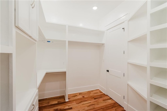 walk in closet featuring hardwood / wood-style floors