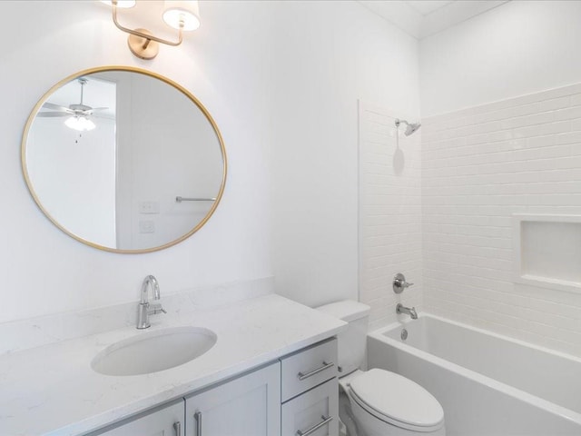 bathroom featuring shower / bath combination, toilet, a ceiling fan, and vanity