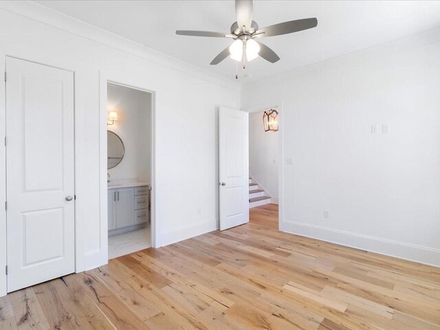 1024 Oxbow Ct, Covington, LA 70433 - unfurnished bedroom with light wood finished floors, ensuite bathroom, and ceiling fan