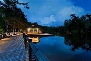view of swimming pool featuring a water view