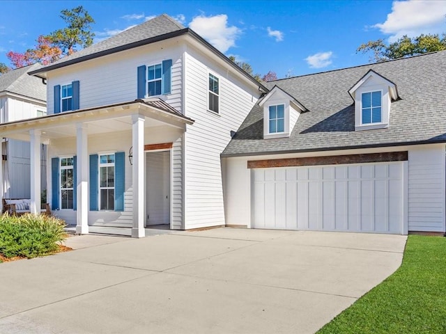 view of front of home with an attached garage, a porch, a shingled roof, and driveway