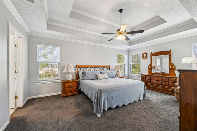 carpeted bedroom with a raised ceiling, ceiling fan, and ornamental molding