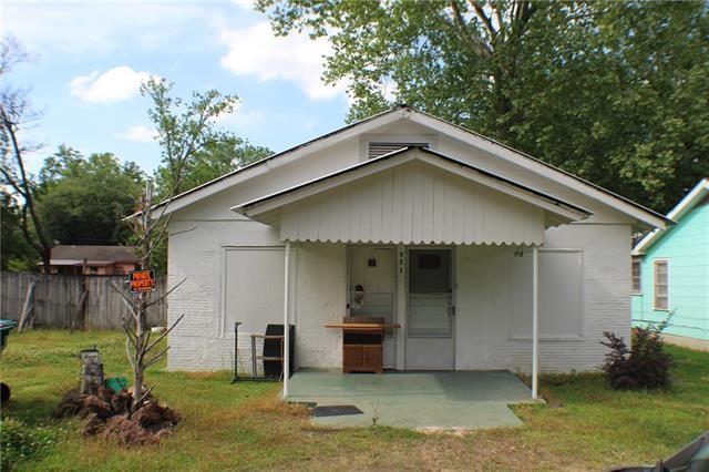 rear view of house featuring a patio and a lawn