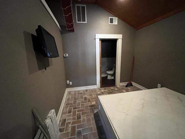 unfurnished bedroom featuring vaulted ceiling