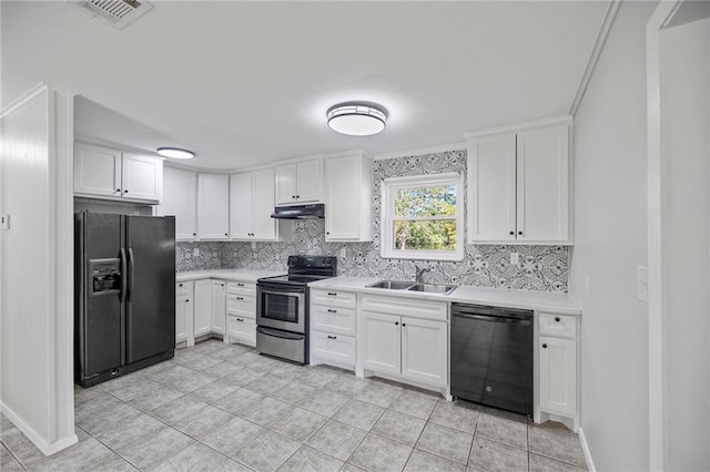 kitchen with backsplash, black appliances, white cabinets, sink, and ornamental molding