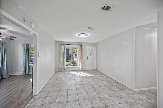 interior space with ceiling fan and light hardwood / wood-style floors