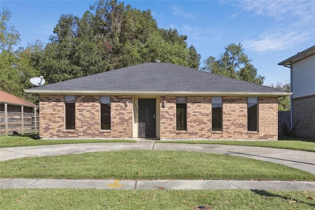 ranch-style home with a front yard