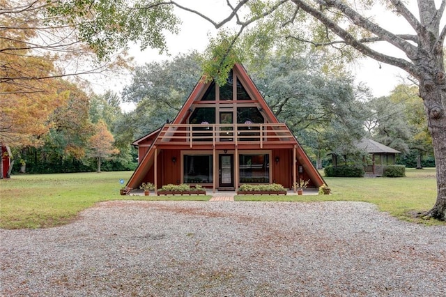 log cabin featuring a front lawn