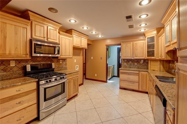 248 Chateau Dr, Slidell, LA 70460 - kitchen featuring light brown cabinets, sink, and stainless steel appliances