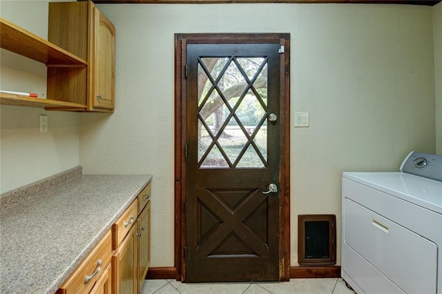 248 Chateau Dr, Slidell, LA 70460 - clothes washing area with cabinets, light tile patterned flooring, and washer / dryer