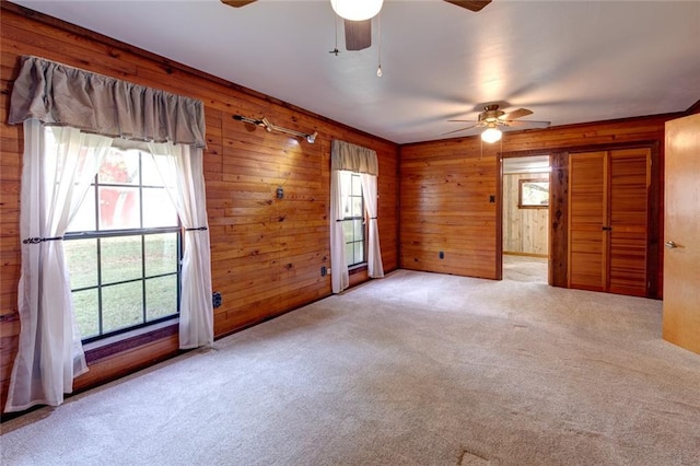 248 Chateau Dr, Slidell, LA 70460 - unfurnished room featuring wood walls and light colored carpet