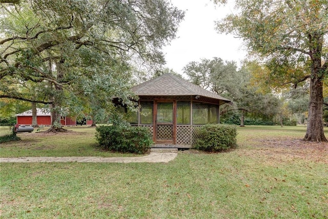 248 Chateau Dr, Slidell, LA 70460 - view of front of home featuring a sunroom and a front lawn