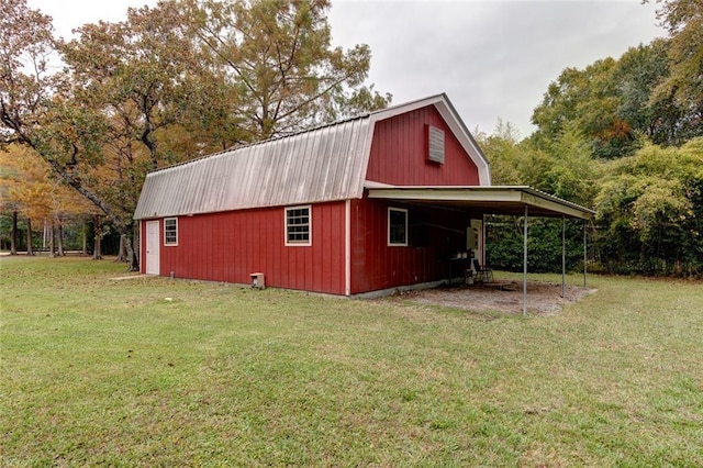 248 Chateau Dr, Slidell, LA 70460 - view of outdoor structure with a yard and a carport