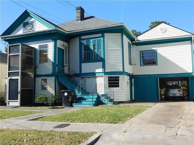 view of front of home featuring a carport